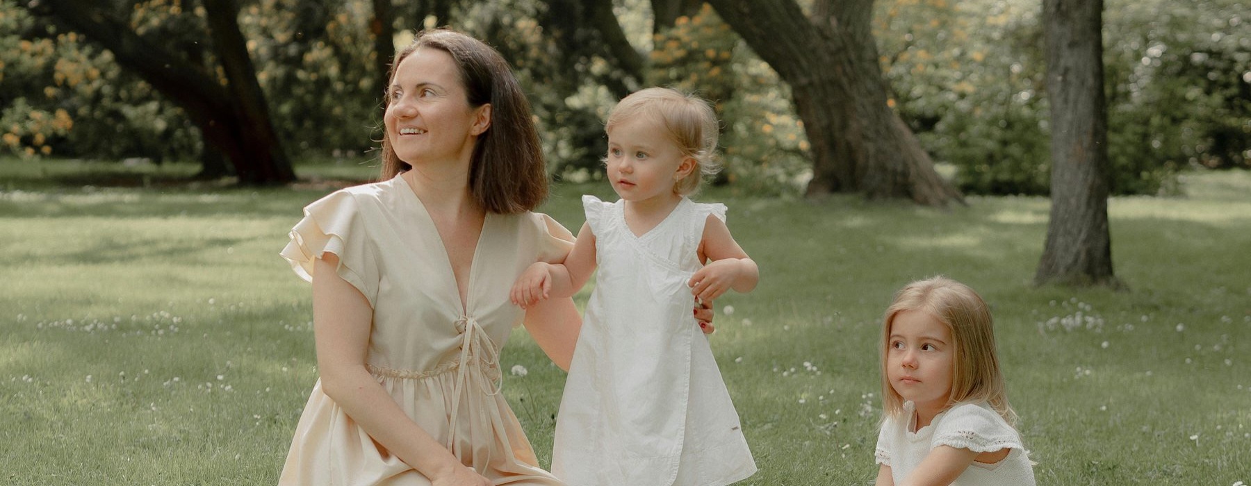 a mom and her kids in a field